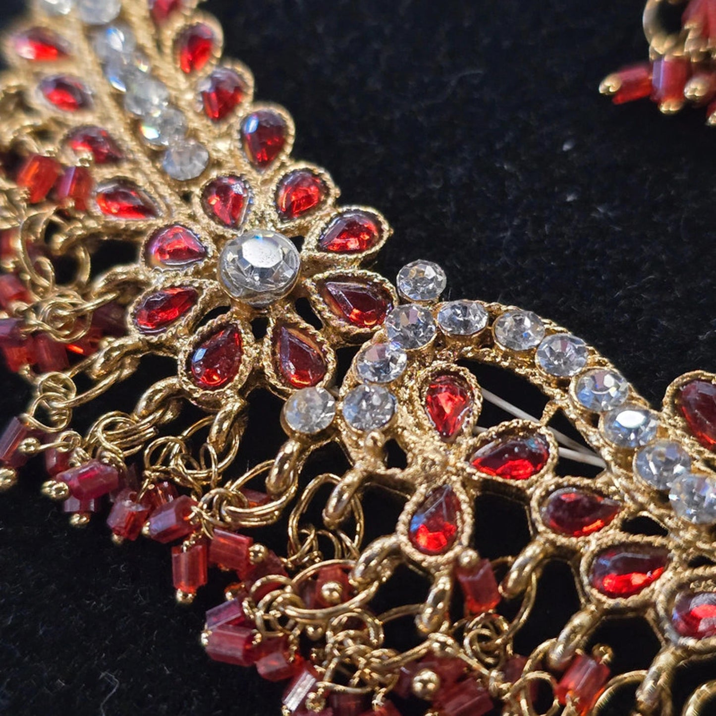 A stunning kundan choker set in gold and red tones
