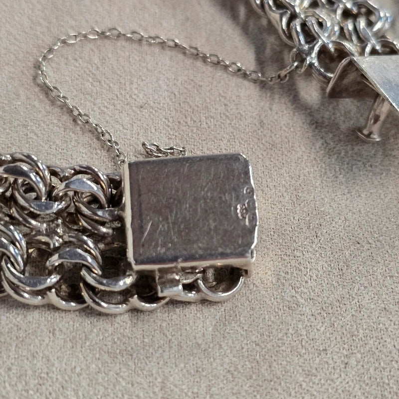 A 1960s hallmarked five row gate link bracelet