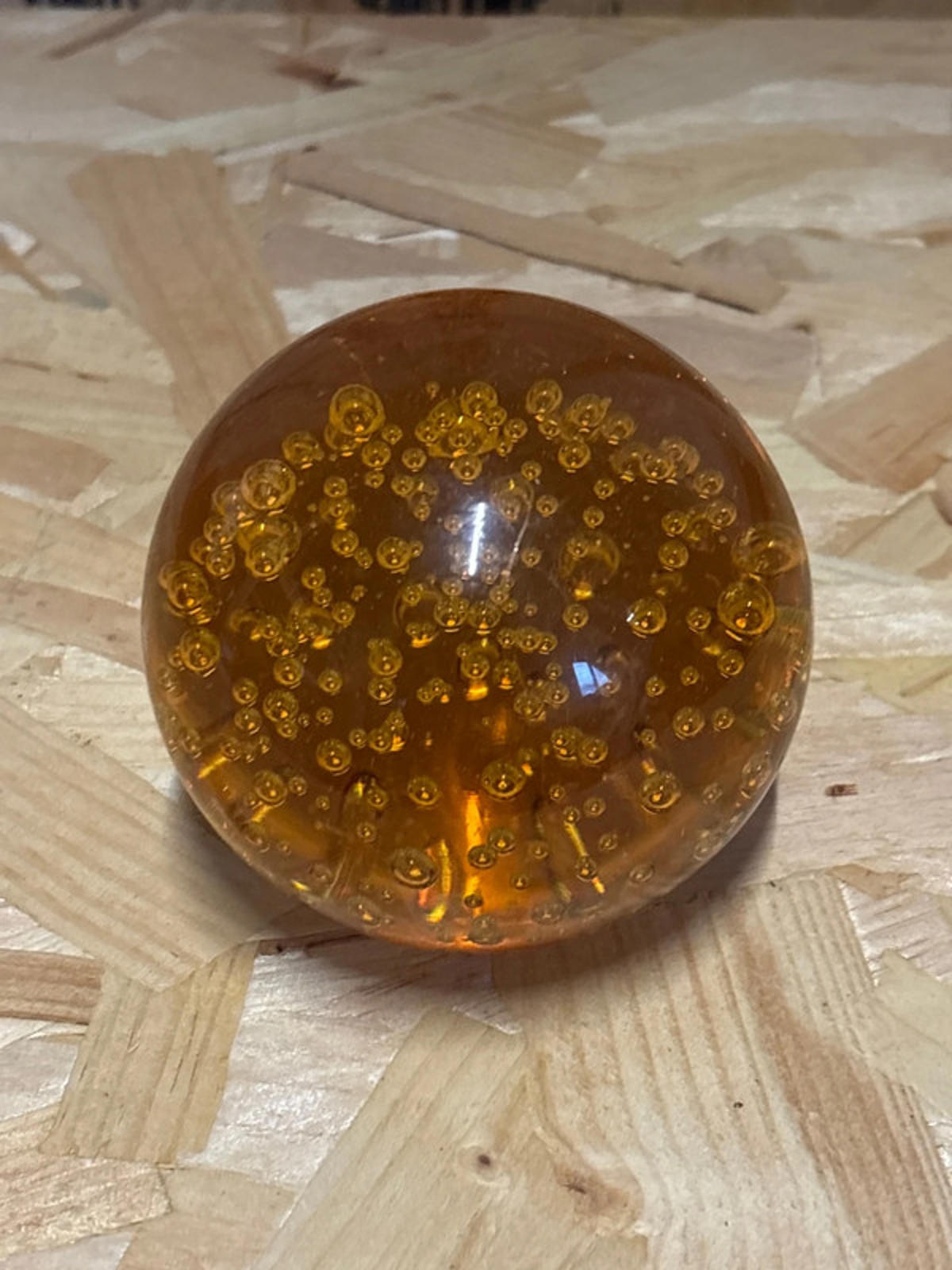 Amber coloured glass paperweight