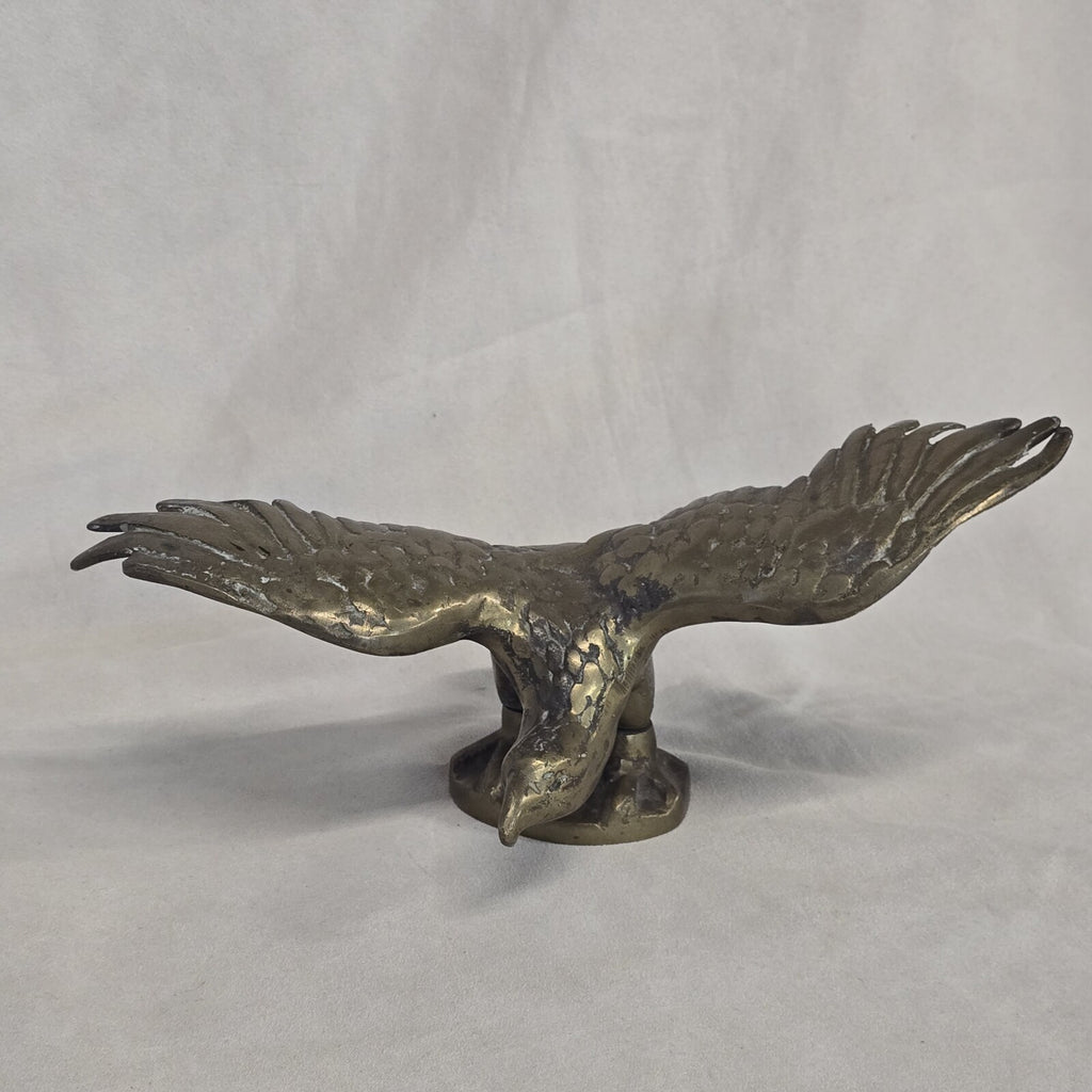 A antique solid and heavy brass free flying eagle