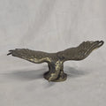 A antique solid and heavy brass free flying eagle