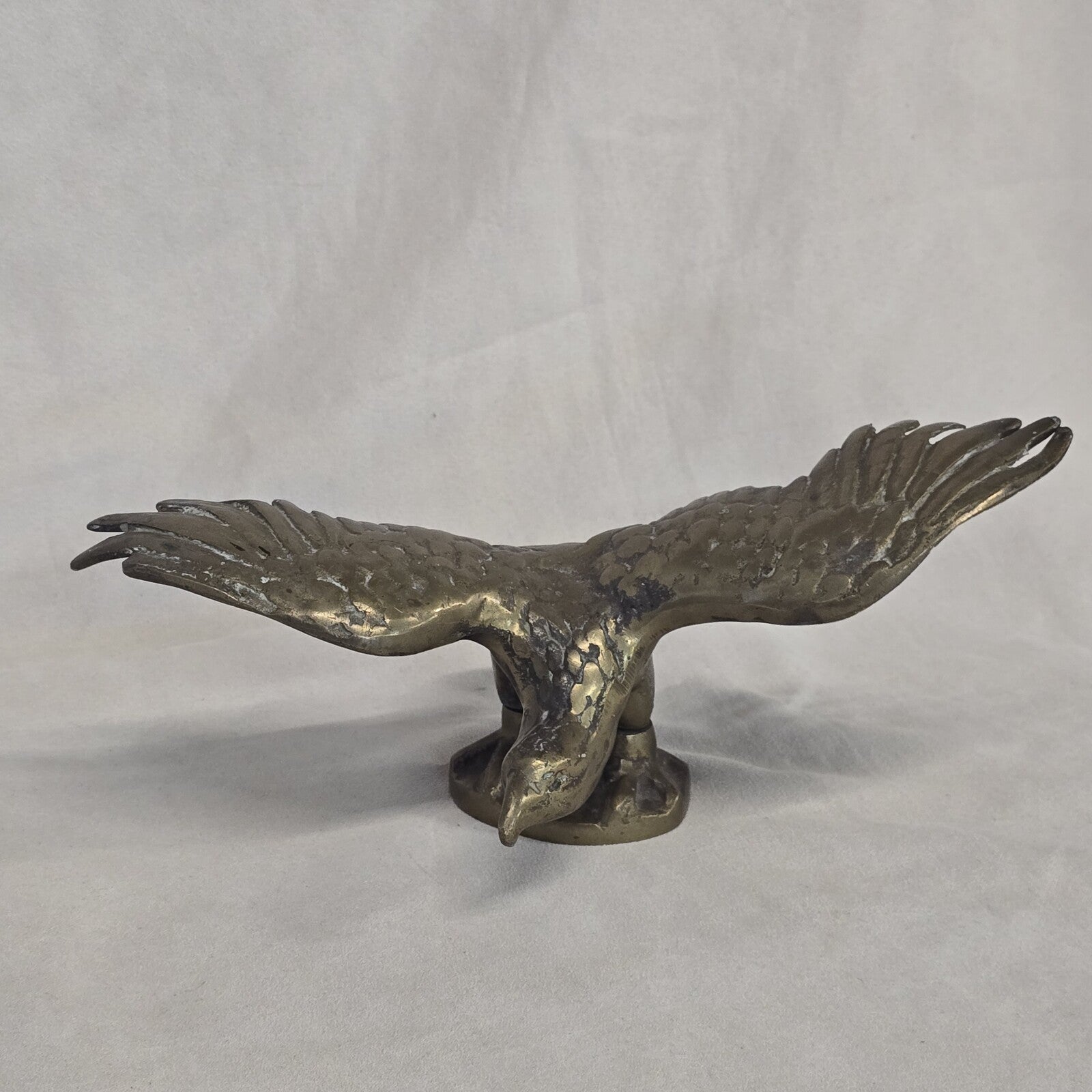 A antique solid and heavy brass free flying eagle