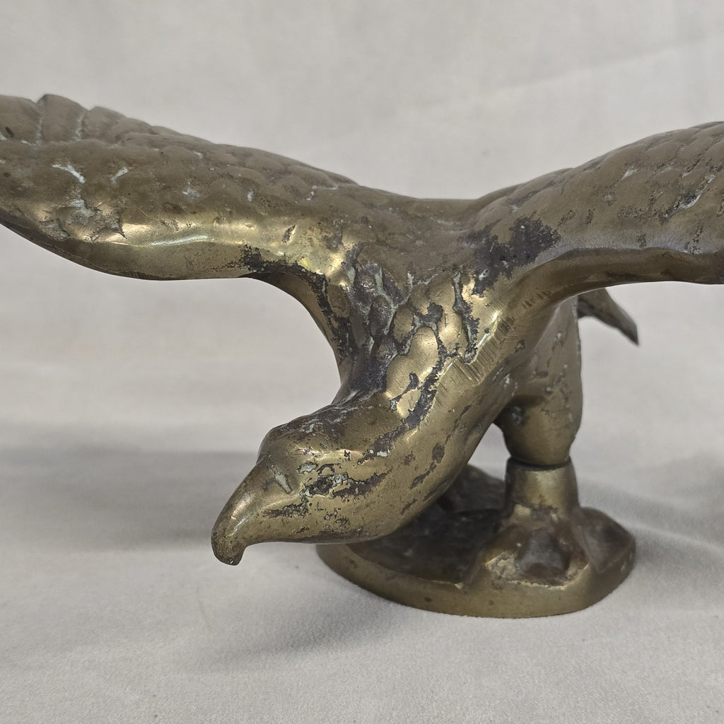 A antique solid and heavy brass free flying eagle