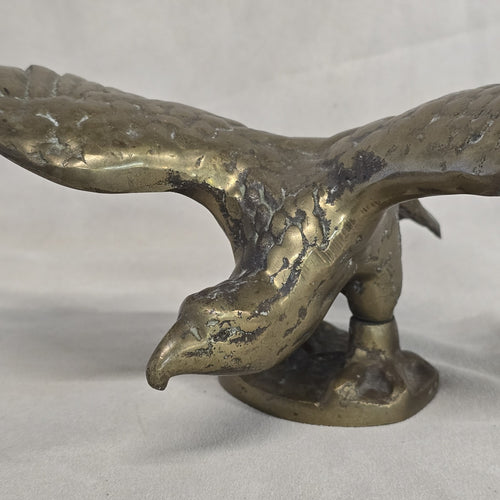 A antique solid and heavy brass free flying eagle