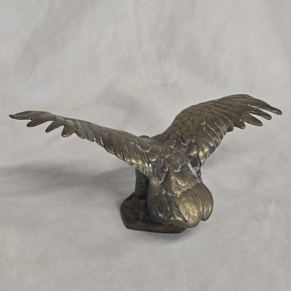 A antique solid and heavy brass free flying eagle