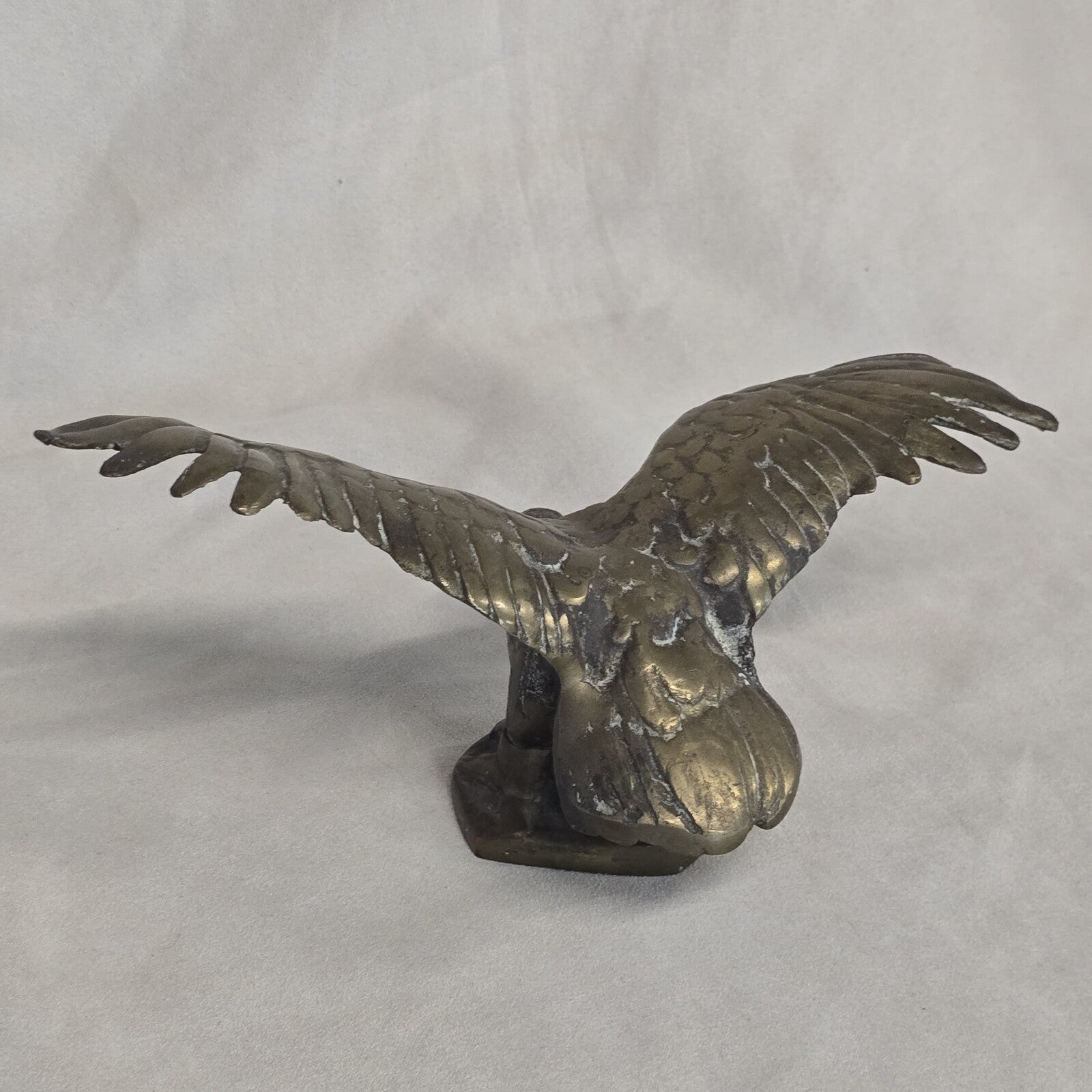 A antique solid and heavy brass free flying eagle
