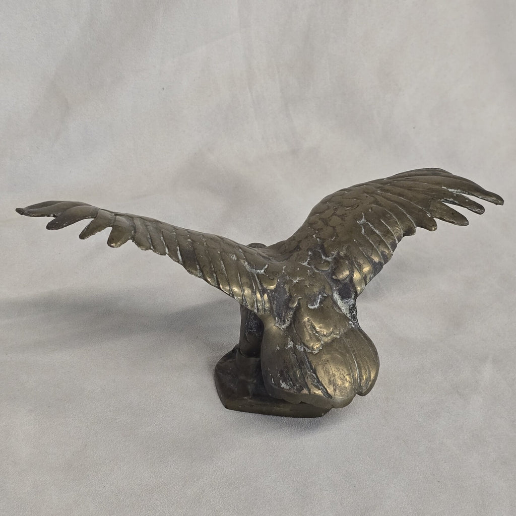 A antique solid and heavy brass free flying eagle