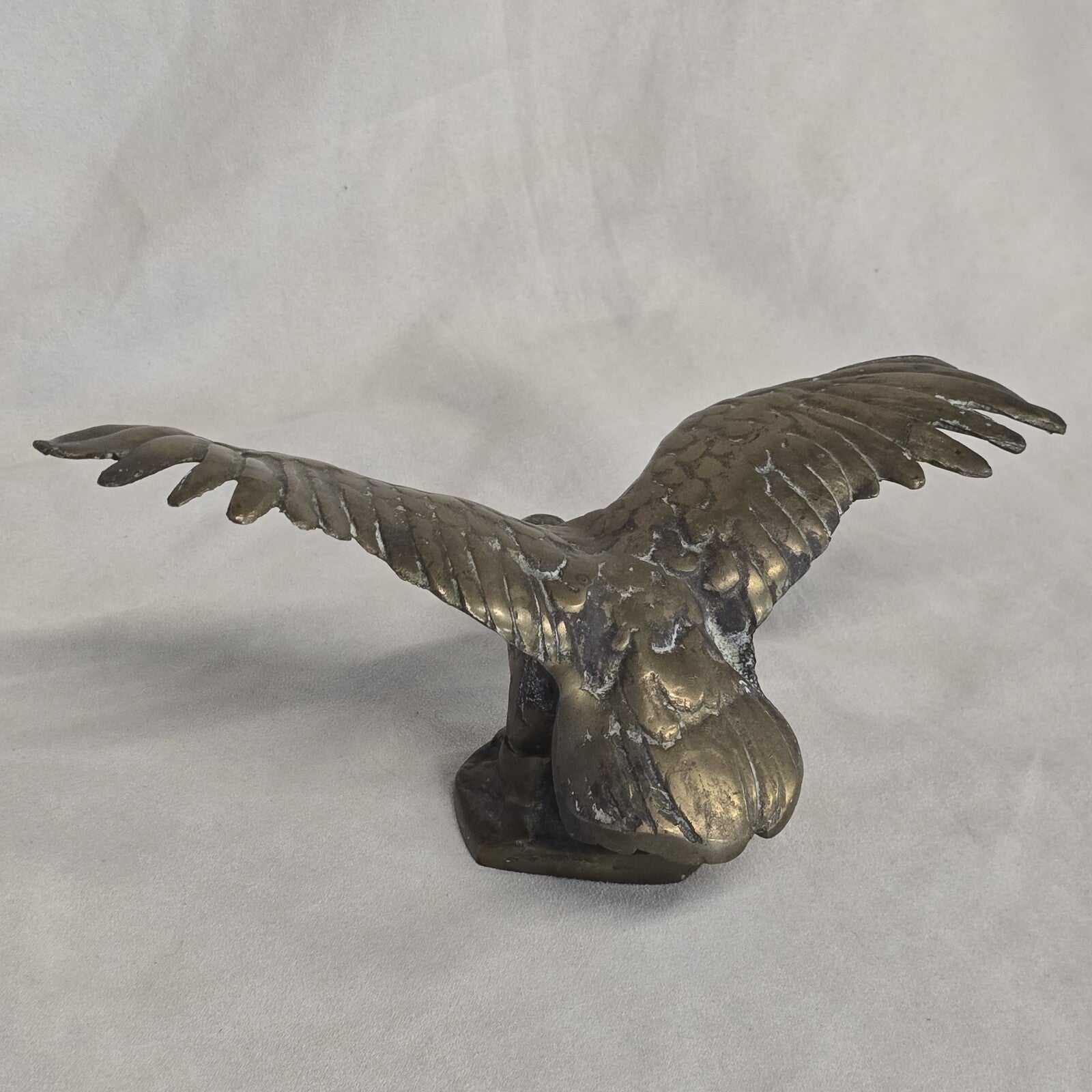 A antique solid and heavy brass free flying eagle