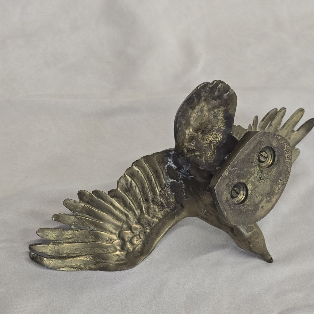 A antique solid and heavy brass free flying eagle