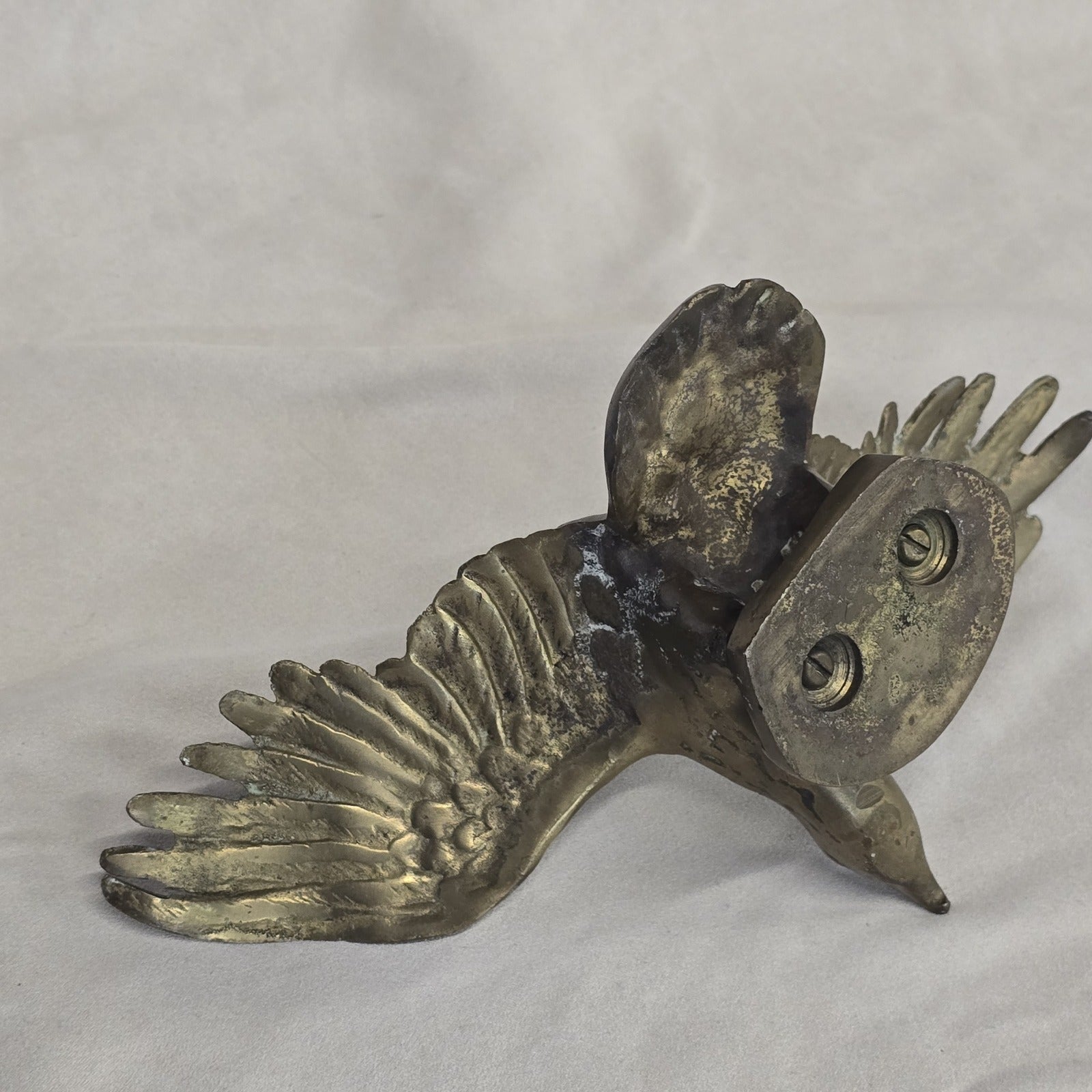 A antique solid and heavy brass free flying eagle