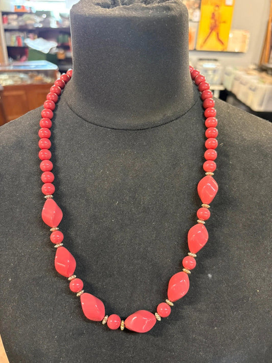 Coral coloured beaded necklace