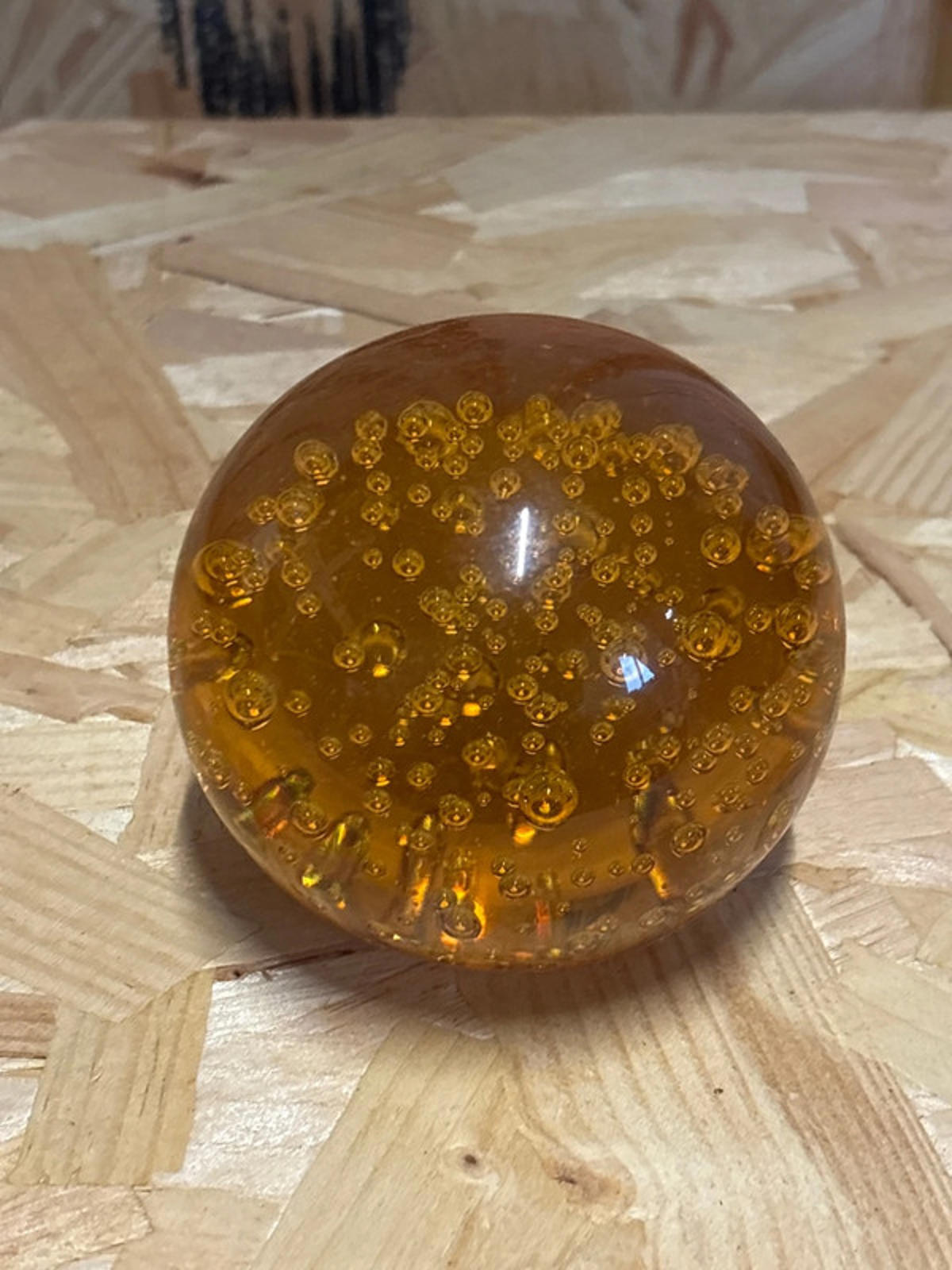 Amber coloured glass paperweight