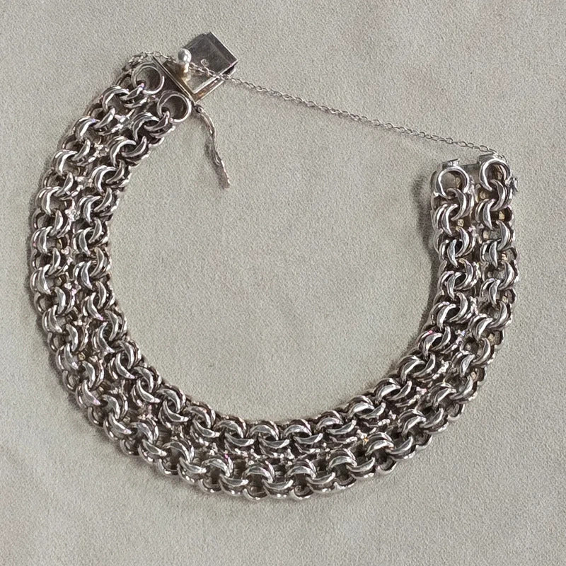A 1960s hallmarked five row gate link bracelet