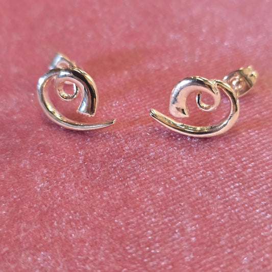 a pair of brand new rose gold coloured earings