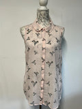 Next | 14 | Pink vest blouse with bird pattern