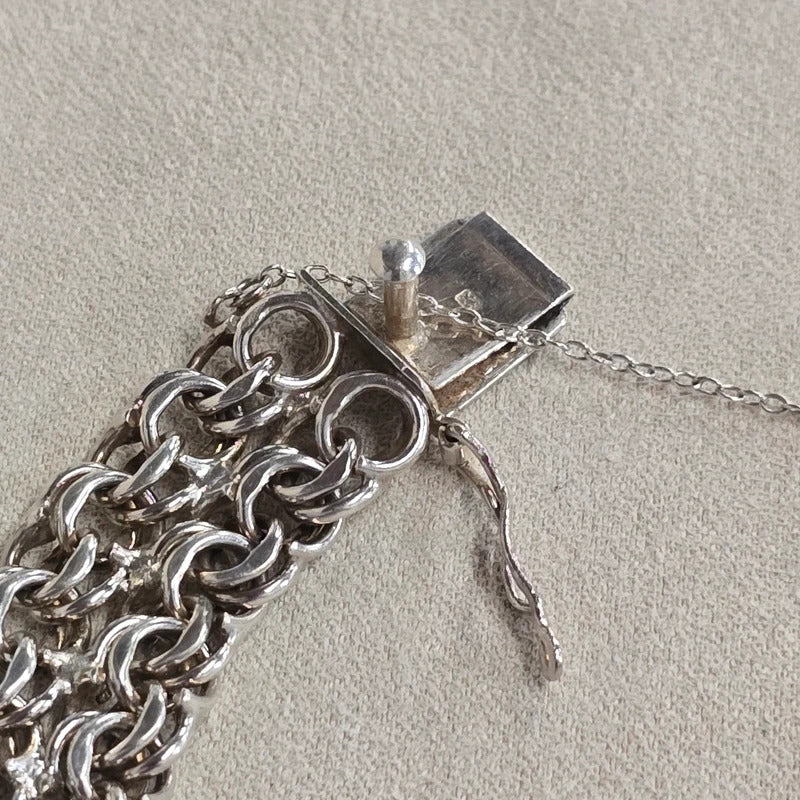 A 1960s hallmarked five row gate link bracelet