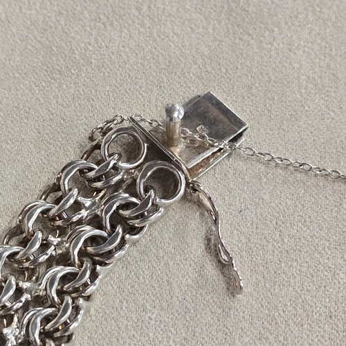 A 1960s hallmarked five row gate link bracelet