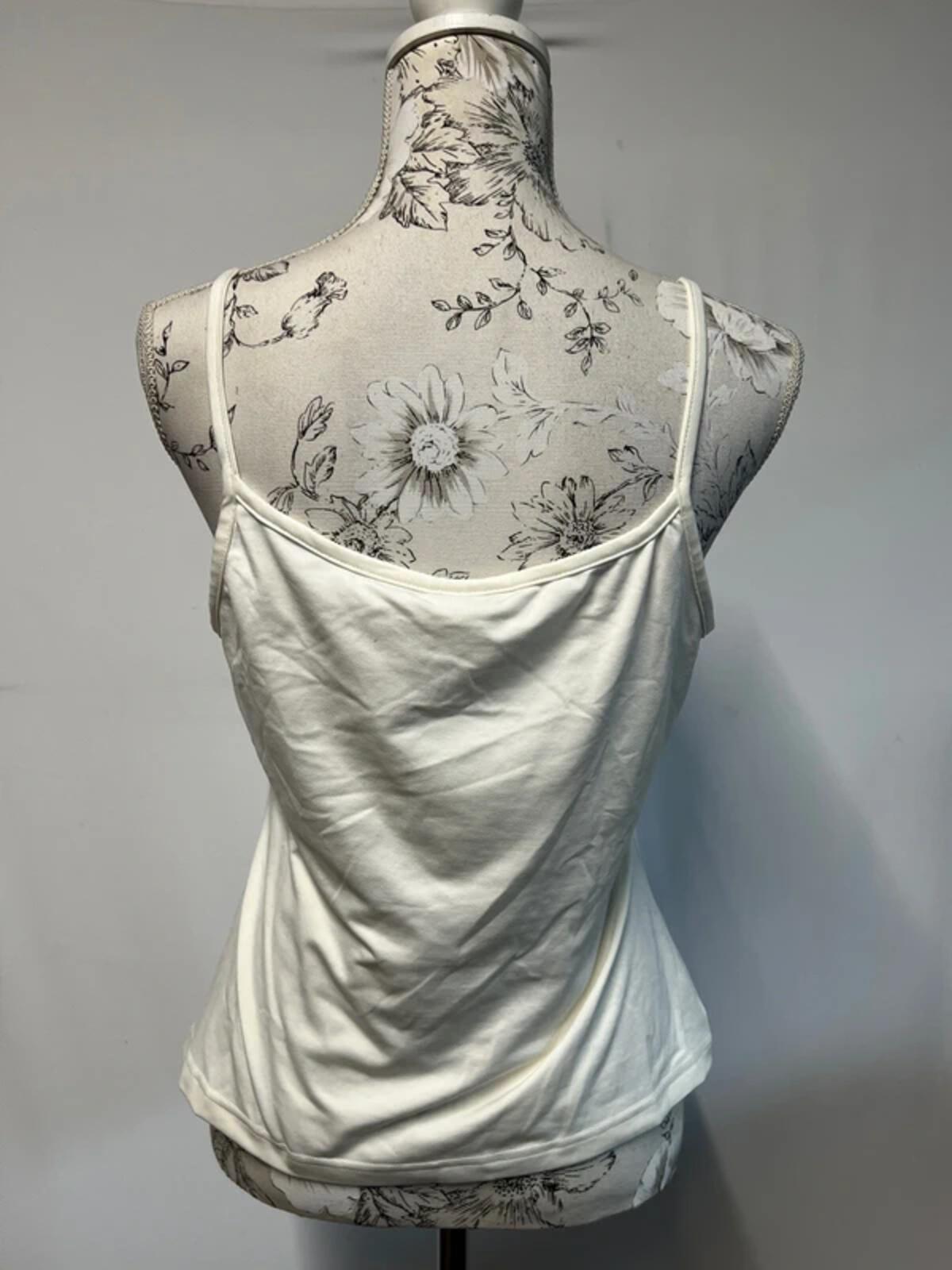 Wallis | 16 | White vest top